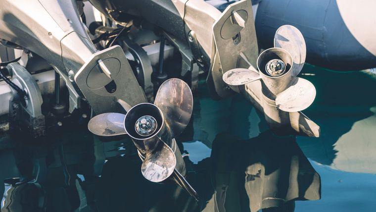 Twin boat propellers and running gear at the waterline